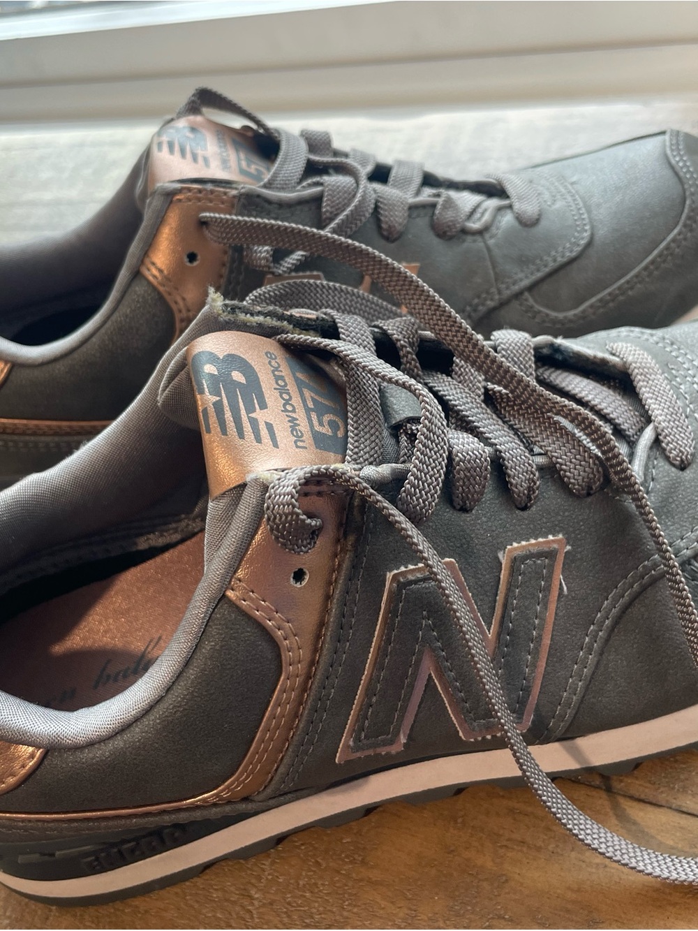 New Balance women’s Gray and Metallic rose gold  Sneakers